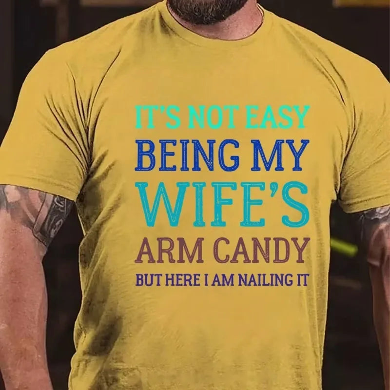 It's Not Easy Being My Wife's Arm Candy But Here I Am Nailing It Graphic T-Shirt