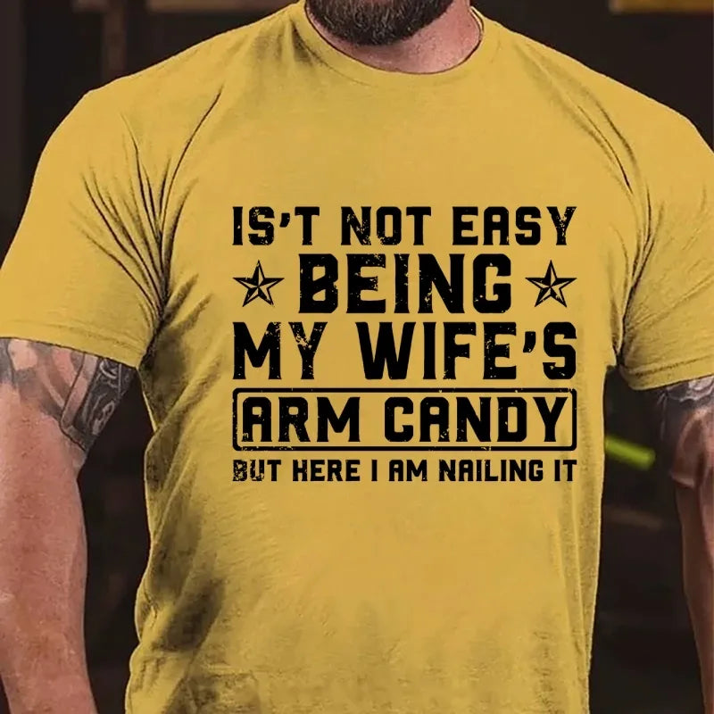 It's Not Easy Being My Wife's Arm Candy But Here I Am Nailing It Graphic T-Shirt