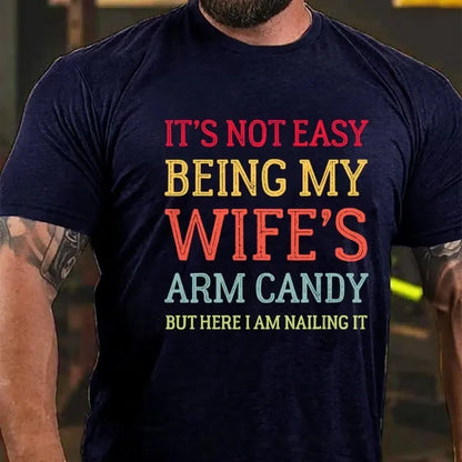 It's Not Easy Being My Wife's Arm Candy But Here I Am Nailing It Graphic T-Shirt
